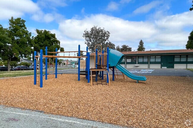 Aptitud Community Academy At Goss features a playground for students to play during recess.