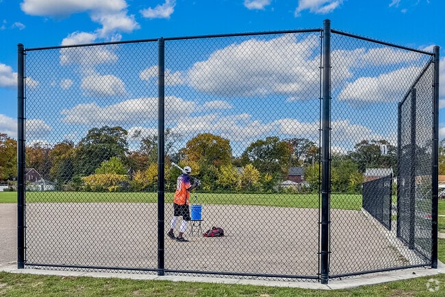A man practices his softball swing at Gemeiner Park in the Schulze neighborhood.