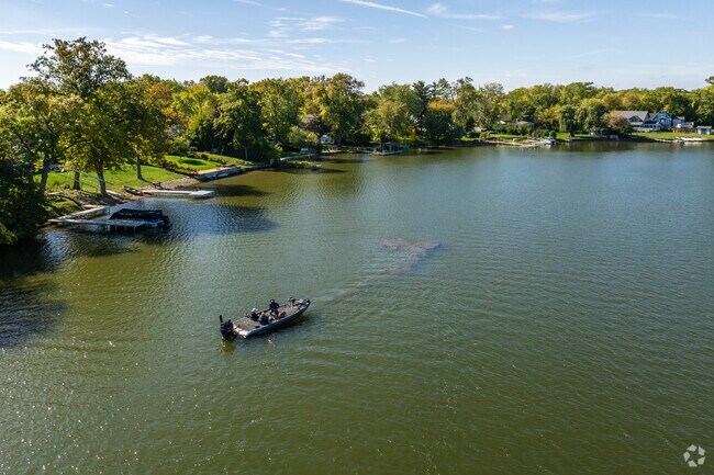 Fishermen take their boats out on Sand Lake in Venetian Village.