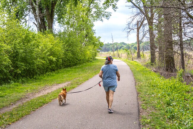 Residents enjoy the walking trails at Vadnais-Sucker Lake Regional Park.