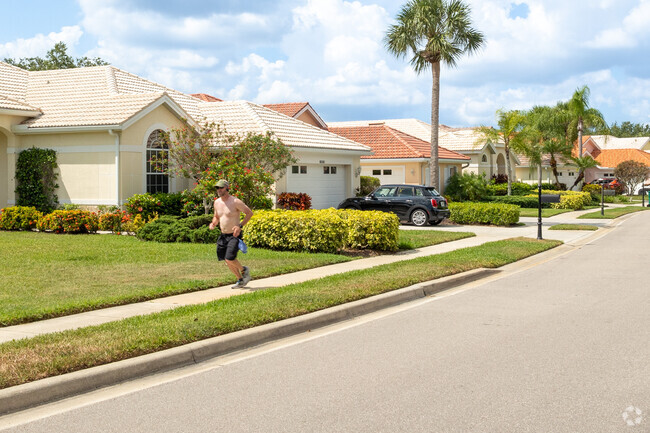 A man jogs past a row of homes in Carlton Lakes.