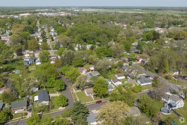 Creston, near Lansing, features streets covered in trees.