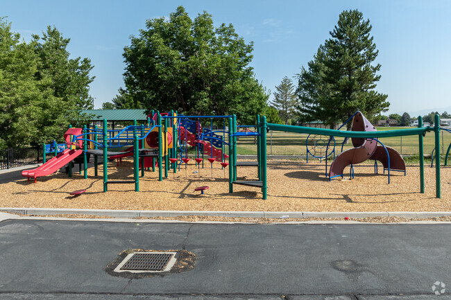 Shade trees surround Oquirrh Elementary School’s playground.