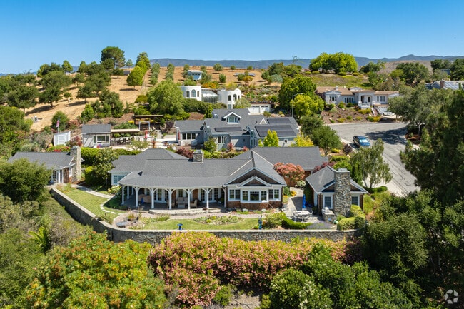 Large homes dominate the hilltops as they overlook the Highland neighborhood and valley.