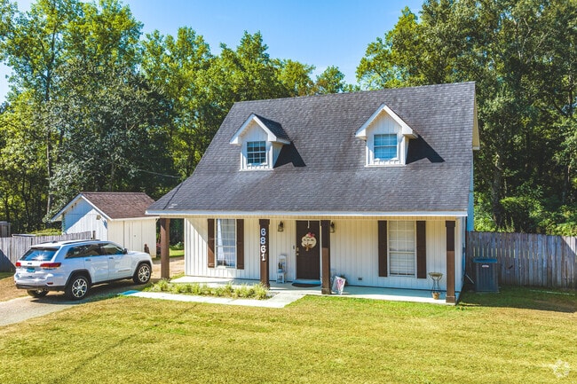 A handful of cottage-style homes stand in Westmont, Mobile.