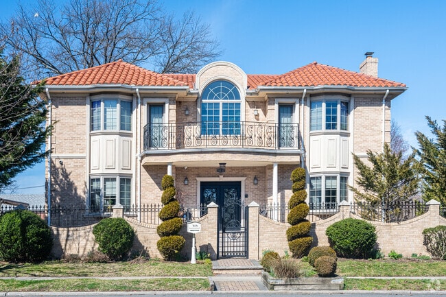 There are many beautiful colonial revival style houses in Fresh Meadows like this one.