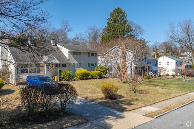 Split level homes in Wayne provide garages with driveways for private parking.