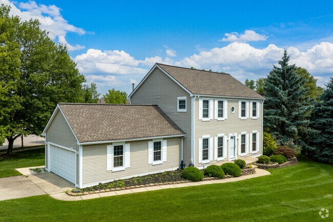 Traditional family homes in Pittsfield Township boast large luxurious lawns.