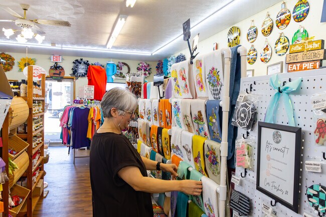 A shopper browses gifts at Moe’s on Main Street.