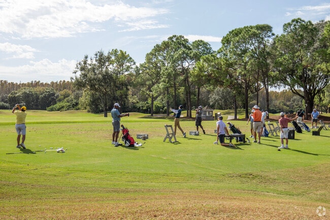 Golfers practice at TPC Tampa Bay Golf course in Lutz.