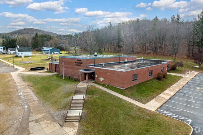 Climb the stairs to the entrance of Knapp Elementary School.