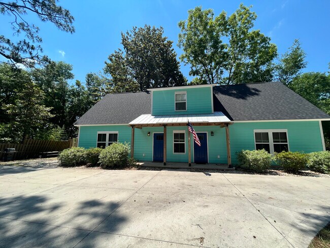 The front of the house, the door on the left leads to the apartment.