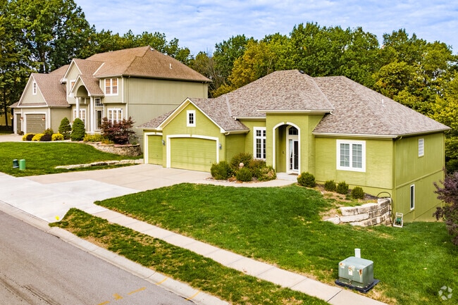 Brightly colored homes in Unity Village include three-car garages.