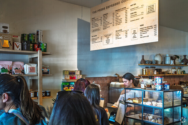 Enjoy a drink at The Press Espresso, a local chain near Paloma del Sol.