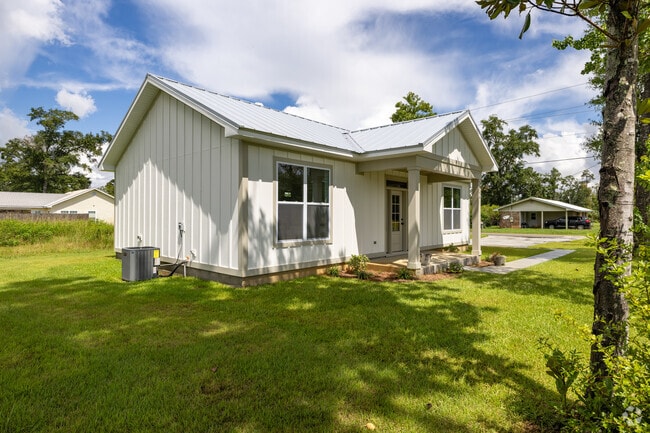 A Wewahitchka ranch home blends modern design with affordable land and natural shade.