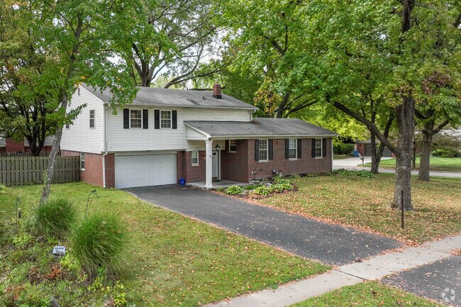 A charming two story home sits on the corner of a delightful St. Vincent Greenbriar street.