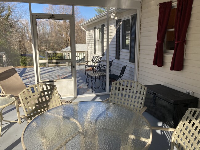 View from sunroom to large deck