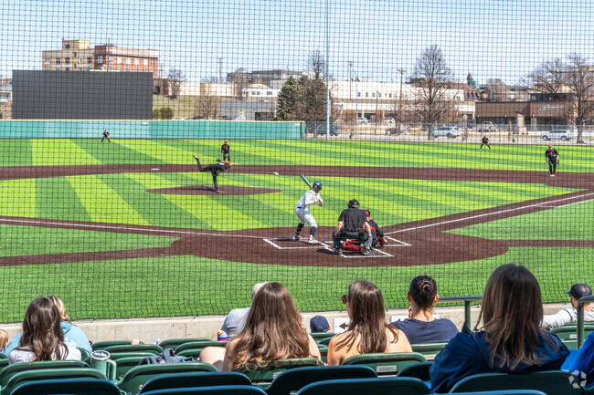 Families gather for a double header during Bismarck Youth Baseball Day at Municipal Ballpark.