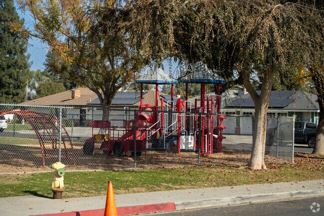 The play ground at Olive Dr Elementary is found on the far East end of the campus.