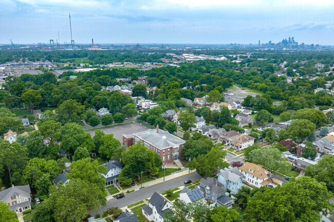 Thomas Sharp Elementary School with the Philadelphia skyline in the distance.