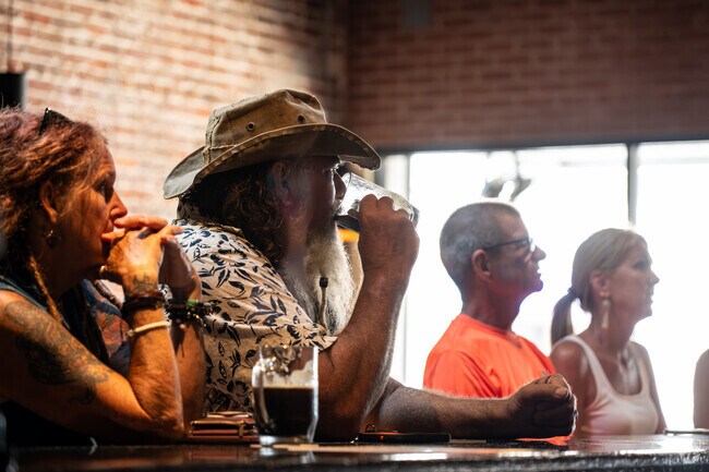 Just outside Bouchelle Island, residents enjoy a beer at New Smyrna Brewing Company.