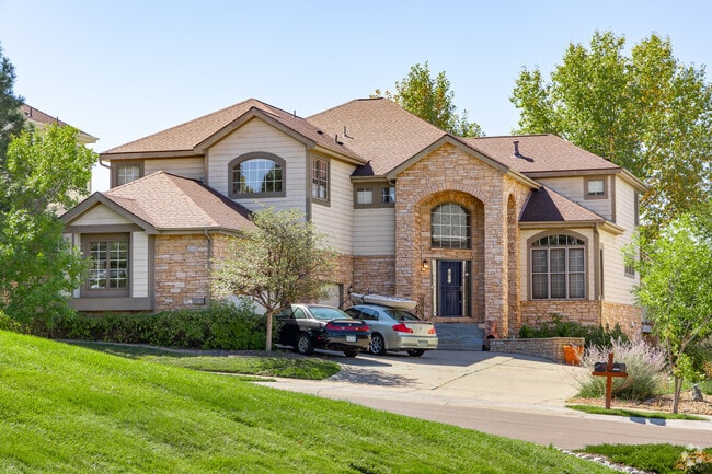 Mansions with stone accents can be found in Saddle Rock Ridge.
