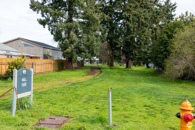 Signage greats you at the south entrance of Mill Park. neighborhood.