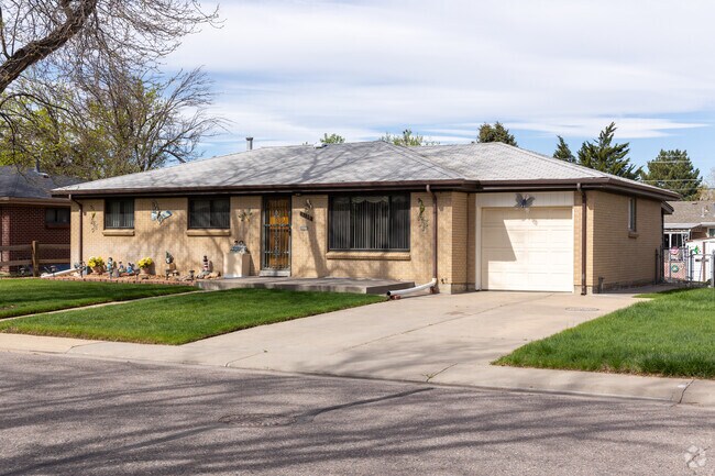 This ranch-style home in Morris Heights features a single-car garage and a small yard.