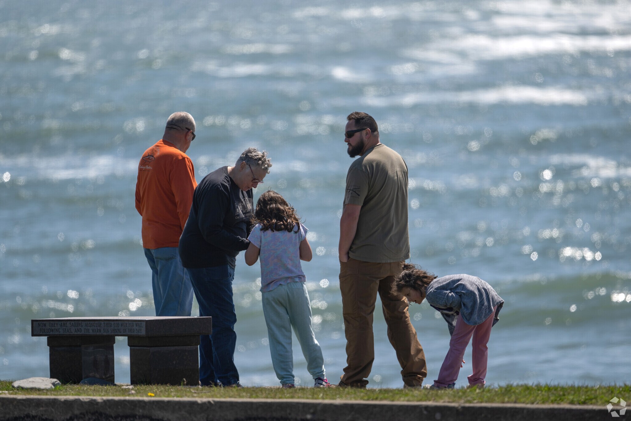Families enjoy the rocky promontory where the Newport Kite Festival is held in mid July.