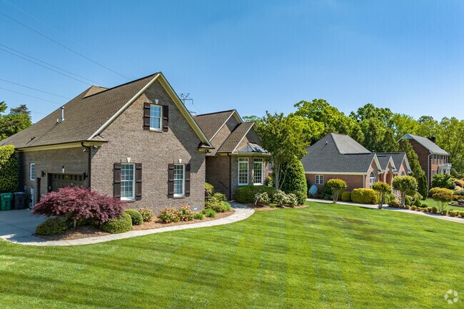Sailing Point's brick homes in Johnson Street Park showcase well-kept lawns.
