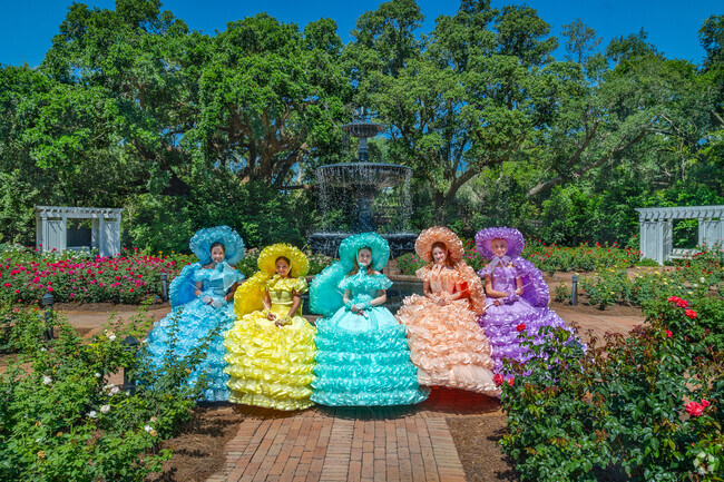 Bellingrath Gardens offers lush gardens of flowers and girls in colorful period attire.