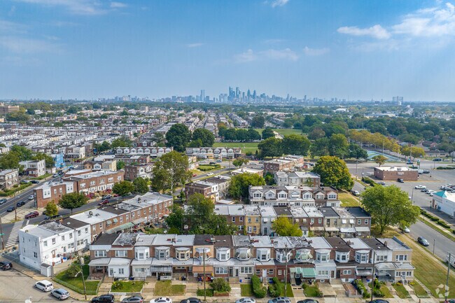 Philadelphia skyline views are visible from many Penrose rowhome rooftops.