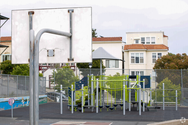 Basketball court with playground in background at Daniel Webster Elementary.