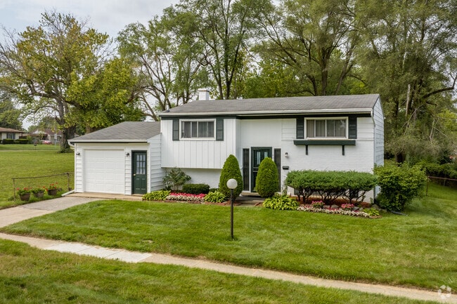 Split-level ranch homes with tidy landscaping line the streets in Beecher.
