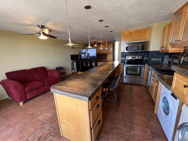 Full kitchen with dining bar