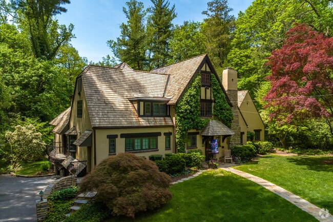 A shady Tudor-style home in Rose Valley.