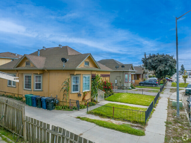 Nestled in perfect harmony, the row of bungalow homes creates a tranquil neighborhood retreat.