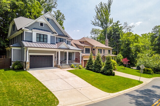 Traditional shingle-style homes are prominent throughout the Bannockburn neighborhood.