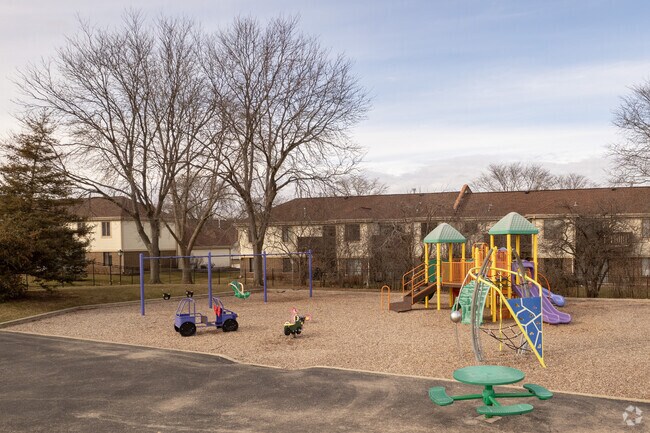 Children enjoy the playground in Osage Park in Capri Village.