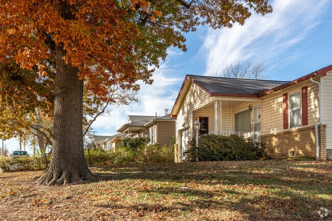 Mature trees grow on grassy lawns in Wedgewood.