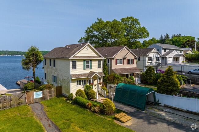 Quaint homes in Hopatcong line the lake, offering charm and close-knit community living.