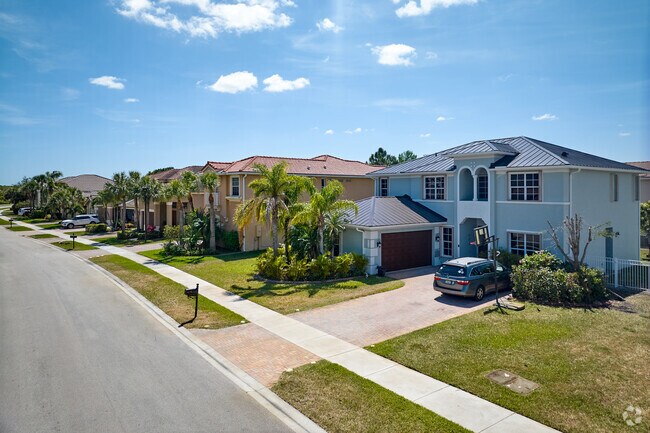 Sidewalks and small trees line the quiet streets of the quiet and pristine Newport Isles.