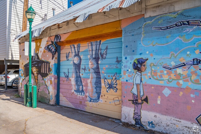 Local artists contribute to wall murals in Southside.