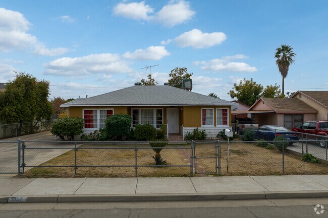 This clean box house with a fenced in large front yard in show pride in ownership in Edison.