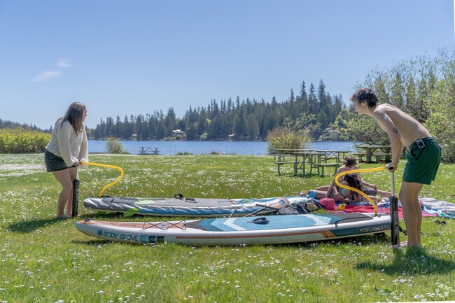 Meet up with friends for paddle boarding at Flowing Lake County Park in Three Lakes near Lake Roesiger.