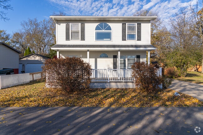Colonial-inspired homes like this one line the quiet, walkable streets of North Utica.