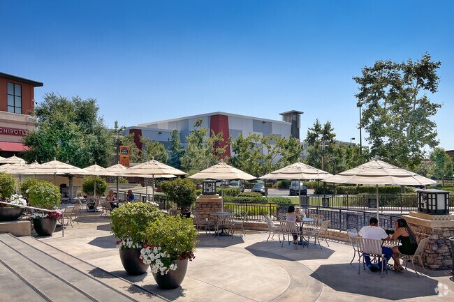 Residents enjoy the outdoor eating areas at Mountain Grove Shopping Center in West Redlands.