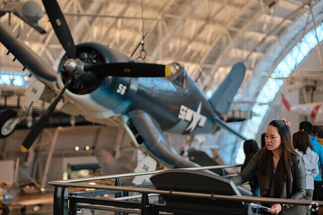 A visitor explores the National Air and Space Museum just outside Kirkpatrick Farms.