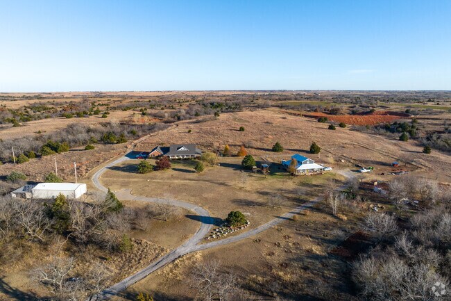 The beautiful hillside in West Blanchard is dotted with cozy houses in large acreages.