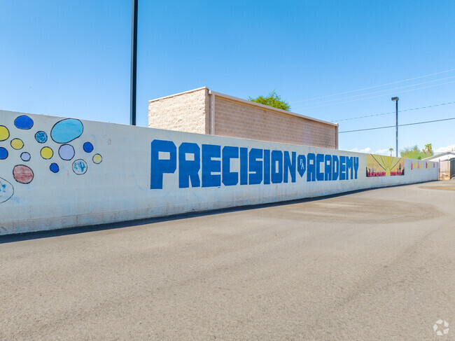 A large mural decorates the outside walls of Precision Academy in Phoenix, AZ.